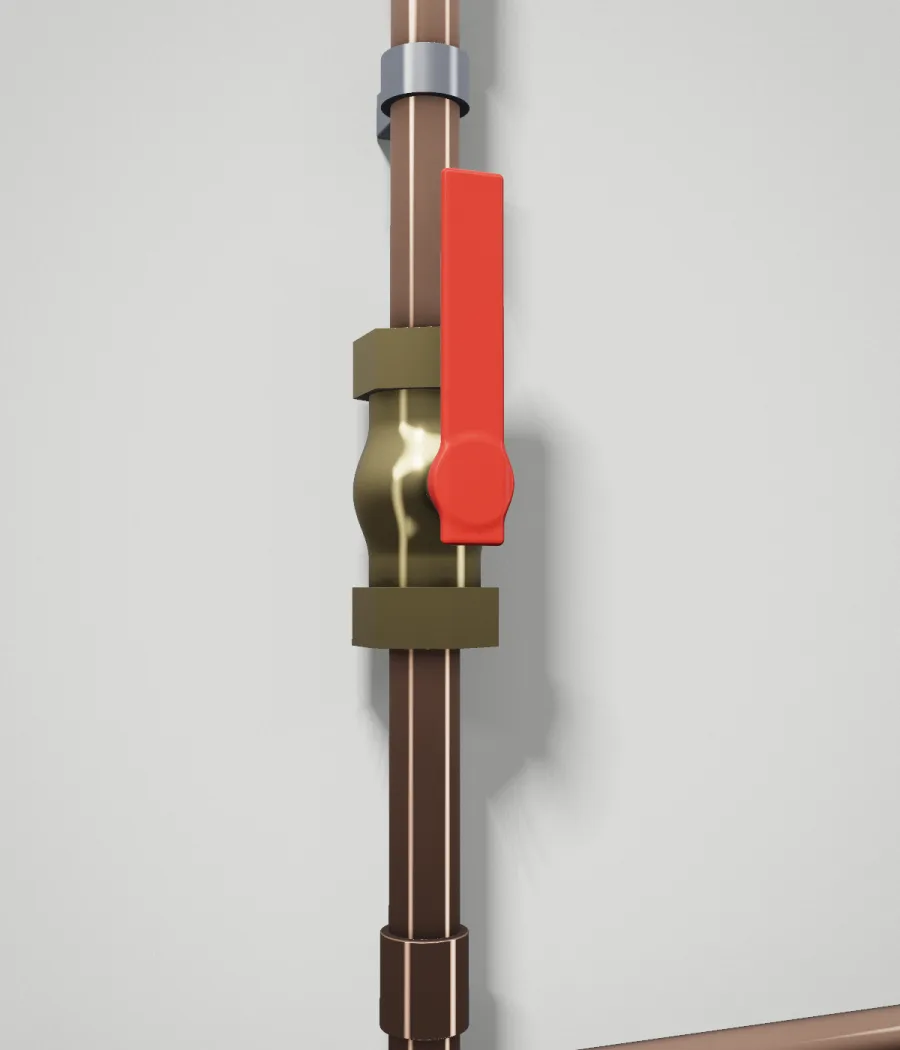 Gros plan d’une vanne à bille en laiton, poignée rouge, sur un tuyau de cuivre vertical.